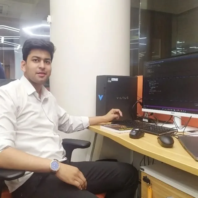 Safdar Ali at his desk with monitors, keyboard, and coding setup in Bengaluru Safdar Ali at his desk with monitors, keyboard, and coding setup in Bengaluru