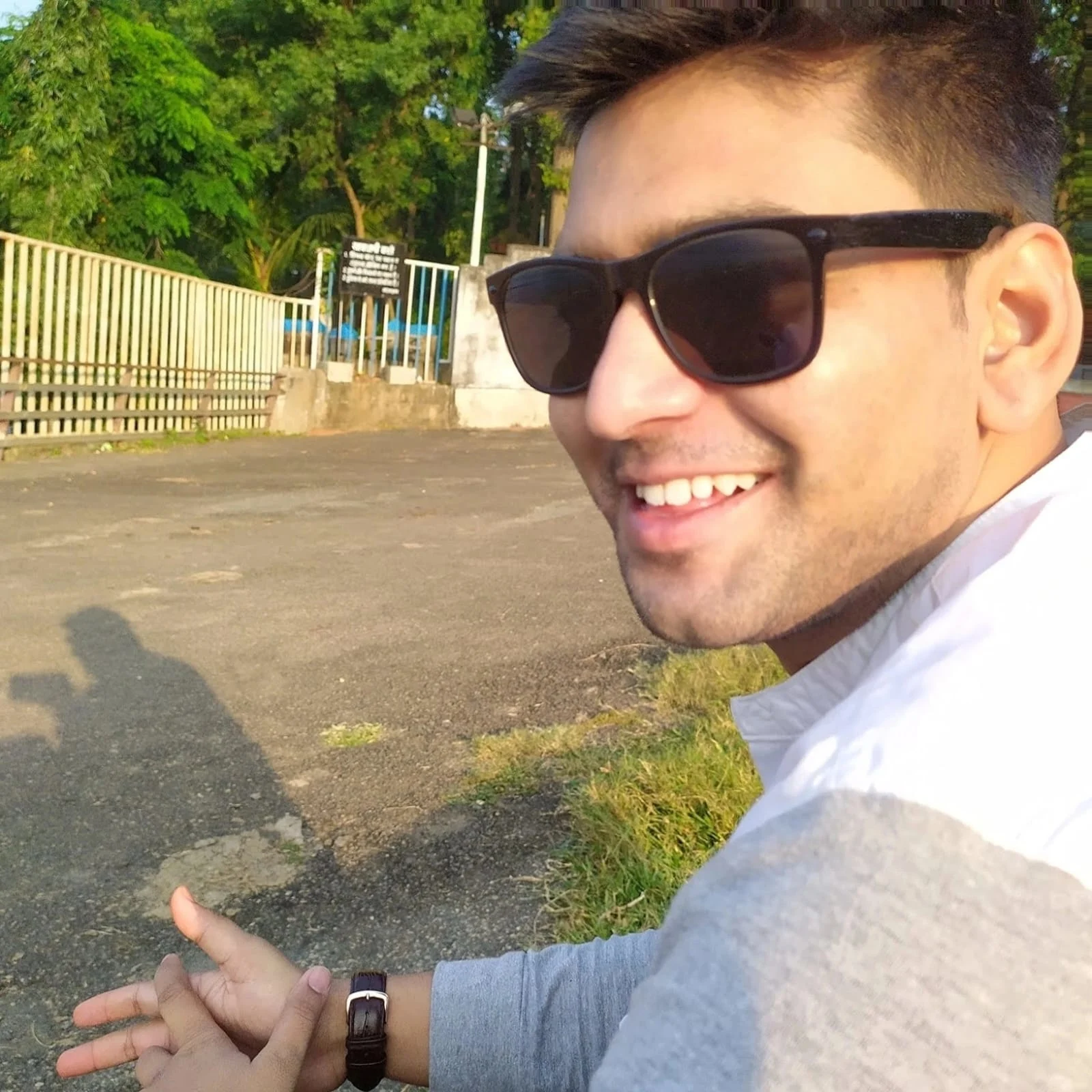 Safdar Ali portrait sitting outdoors wearing sunglasses Safdar Ali portrait sitting outdoors wearing sunglasses
